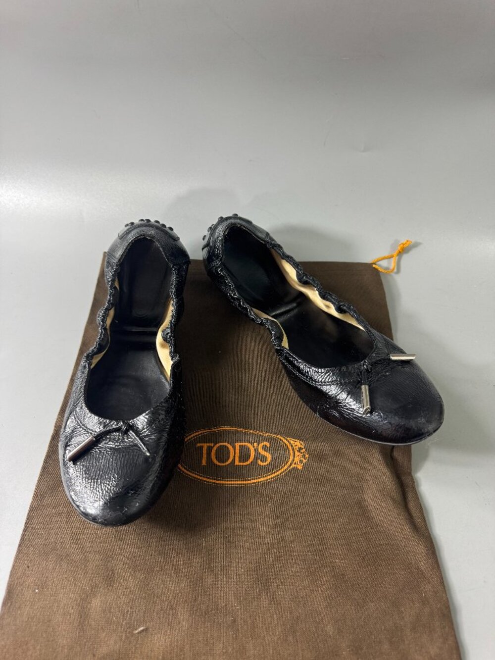 Authentic Tod’s Black Patent Leather Ballerina Laccetto Flats, Size 37 1/2